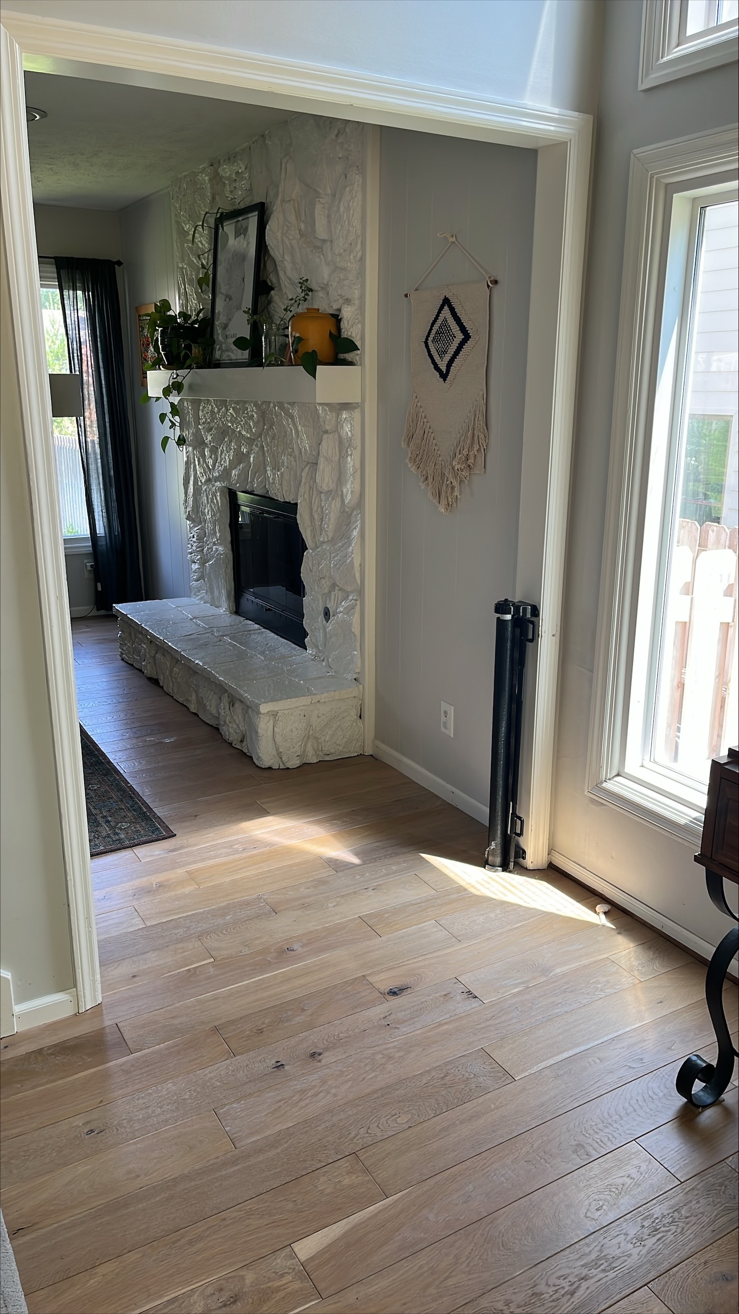 An entryway floored in whitewash oak hardwood